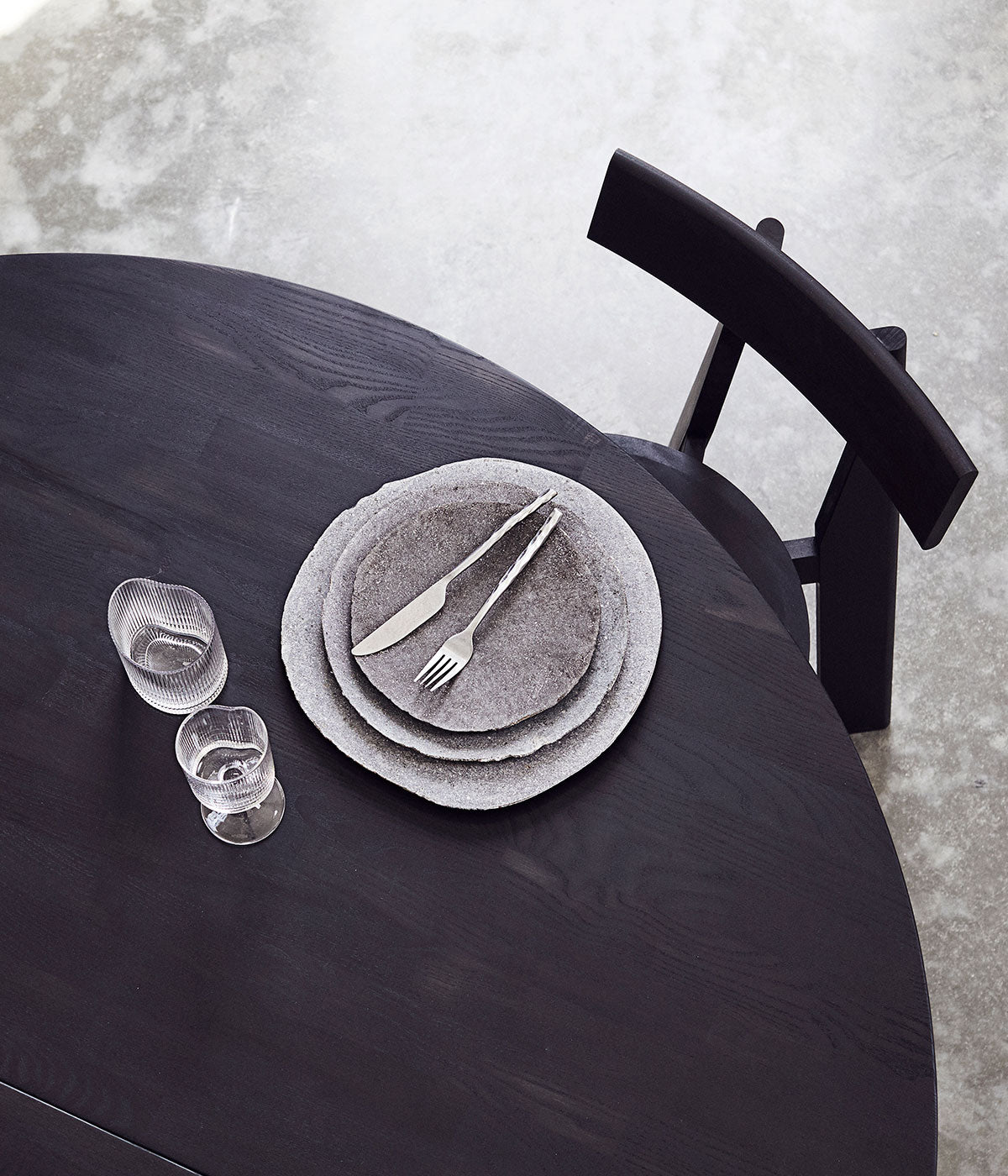 Muubs Round Dining Table in Ash Black with Black Coated Metal Legs